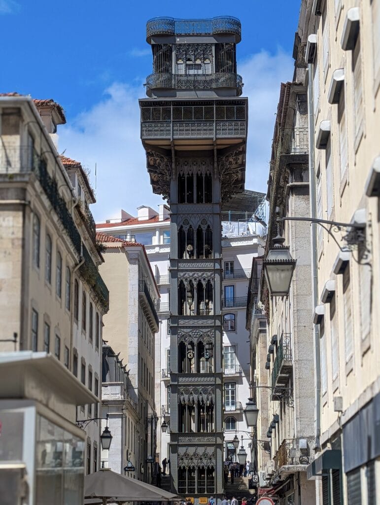 Elevador de Santa Justa Lisbon, a wrought-iron elevator tower viewed from street level.